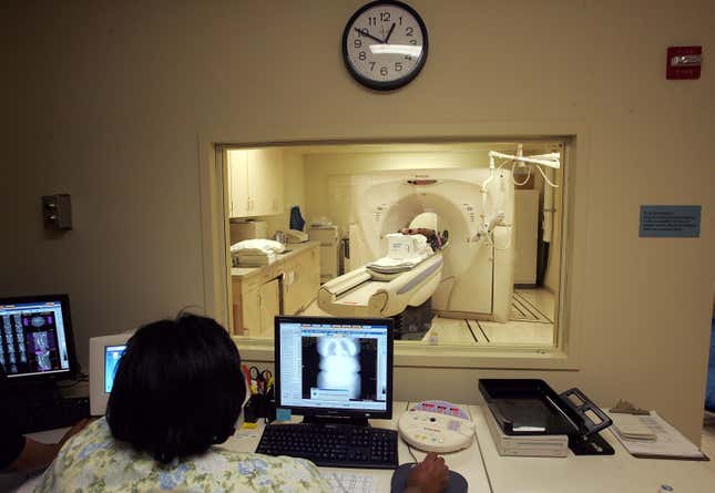 A woman gets a CT scan for breast cancer.