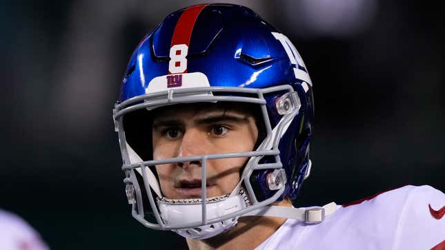 Teammates tip their helmets to Daniel Jones