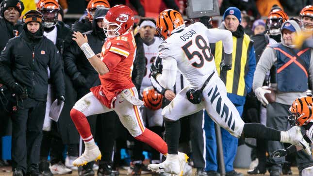 Kansas City Chiefs quarterback Patrick Mahomes heads out of bounds in front of Cincinnati Bengals’ defensive end Joseph Ossai during the last second of the game on Jan. 29, 2023, at Arrowhead Stadium.
