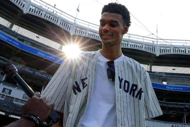 Jun 20, 2023; Bronx, New York, USA; French NBA draft prospect Victor Wembanyama speaks to the media during batting practice before a game between the New York Yankees and the Seattle Mariners at Yankee Stadium.