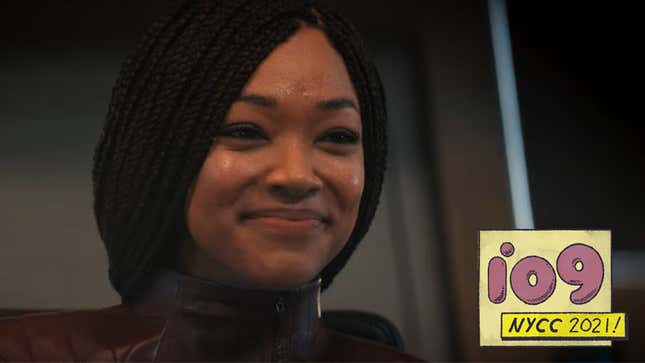 Sonequa Martin-Green's Captain Michael Burnham grins as she sits in the U.S.S. Discovery's Captain's chair.
