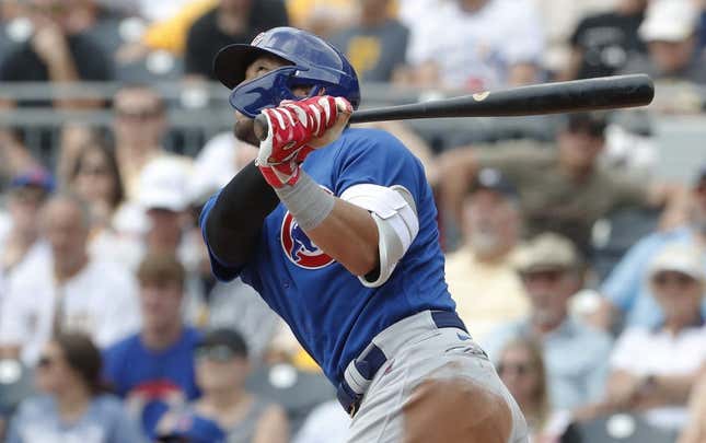 Jun 21, 2023; Pittsburgh, Pennsylvania, USA; Chicago Cubs right fielder Seiya Suzuki (27) hits a sacrifice fly RBI against the Pittsburgh Pirates during the third inning at PNC Park.