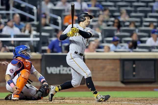 Aug 15, 2023; New York City, New York, USA; Pittsburgh Pirates left fielder Bryan Reynolds (10) follows through on an RBI triple against the New York Mets during the seventh inning at Citi Field.