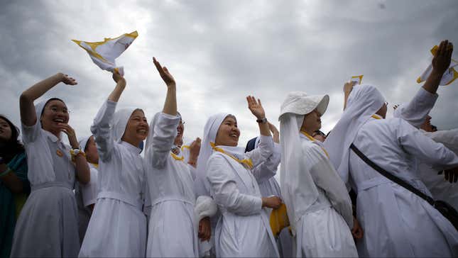 Nuns wave at Pope Francis from Haemi Castle in South Korea.