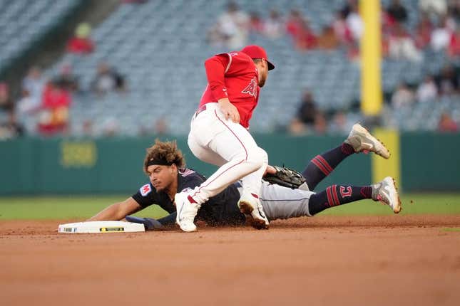 Sep 7, 2023; Anaheim, California, USA; Cleveland Guardians first baseman Josh Naylor (22) slides into second base to beat a throw to Los Angeles Angels second baseman Brandon Drury (23) in the first inning at Angel Stadium.