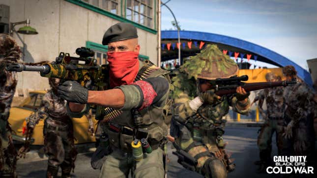 Image of man wearing a face concealing red scarf wielding assault rifle surrounded by armed and camouflaged individuals in Call of Duty Black Ops Cold War.