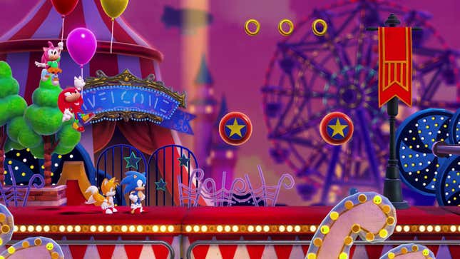 Sonic, Tails, Knuckles, and Amy are shown moving through a carnival-like level.