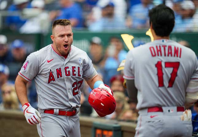 Jun 18, 2023; Kansas City, Missouri, USA; Los Angeles Angels center fielder Mike Trout (27) celebrates with designated hitter Shohei Ohtani (17) after hitting a home run during the fifth inning at Kauffman Stadium.