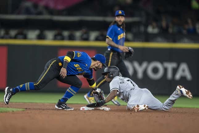 Jun 16, 2023; Seattle, Washington, USA; Chicago White Sox shortstop Tim Anderson (7) steals second against Seattle Mariners second baseman Jose Caballero during the third inning at T-Mobile Park.