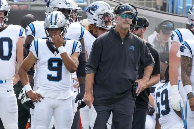 Aug 12, 2023; Charlotte, North Carolina, USA; Carolina Panthers head coach Frank Reich stands on the sideline with quarterback Bryce Young (9) during the first quarter against the New York Jets at Bank of America Stadium.