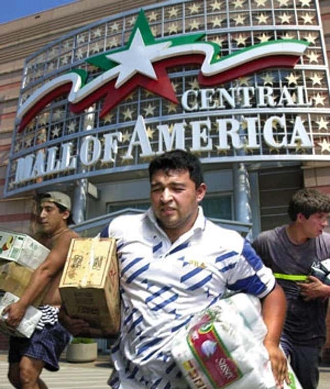 Mall of Central America visitors sprint toward the "El Salvador" parking lot.