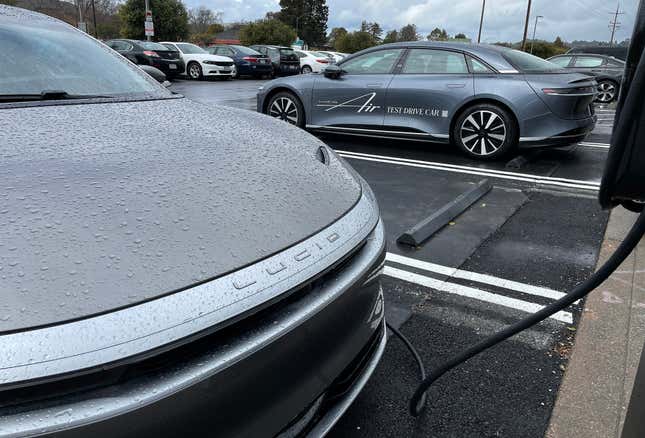  A Lucid electric vehicle sits parked at a charging station outside of a Lucid Studio on March 29, 2023 in Corte Madera, California. Electric vehicle maker Lucid announced plans to lay off 1,300 workers, 18 percent of its workforce, as part of a restructuring plan.