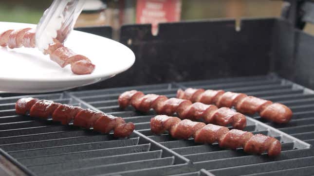 Spiral cut hot dogs on a grill