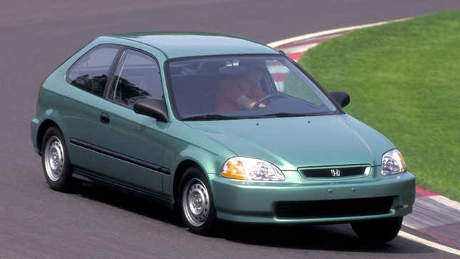 A photo of a green Honda Civic on a track.
