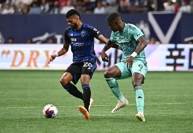 Aug 20, 2023; Vancouver, British Columbia, CAN; Vancouver Whitecaps FC forward Sergio Cordova (9) defends against San Jose Earthquakes defender Rodrigues (26) during first half at BC Place.