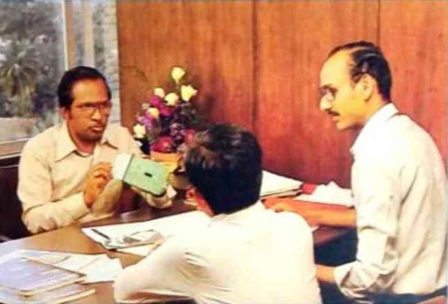Sridhar Mitta (facing the camera) in discussion with colleagues at Wipro.