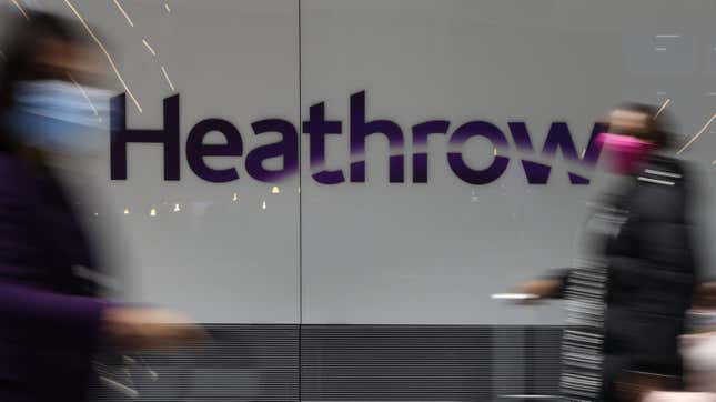 Travelers pass through London’s Heathrow airport in 2021.