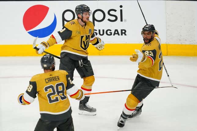 Jun 13, 2023; Las Vegas, Nevada, USA; Vegas Golden Knights defenseman Alec Martinez (23) celebrates his goal with forward William Carrier (28) and forward Jack Eichel (9) during the second period in game five of the 2023 Stanley Cup Final at T-Mobile Arena.