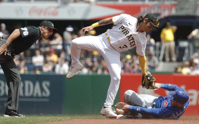 Aug 27, 2023; Pittsburgh, Pennsylvania, USA;  Chicago Cubs designated hitter Cody Bellinger (right) steals second base as Pittsburgh Pirates second baseman Ji Hwan Bae (3) applies a late tag during the first inning at PNC Park.