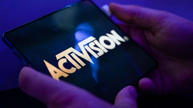 An Activision logo is displayed on a phone as someone posts. 