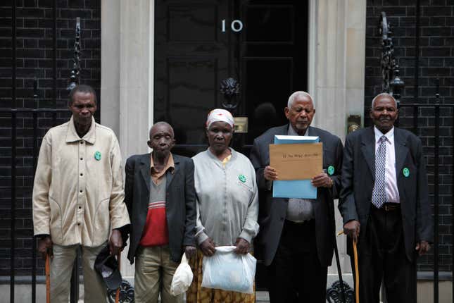 Kenyans at 10 Downing Street prior to handing in their petition against the then British colonial regime. According to the petition, during the struggle for Kenyan independence in the 1950’s and 1960’s they were arrested, detained in detention camps accused of being members of the Mau Mau movement and tortured. (AP Photo/Lefteris Pitarakis)