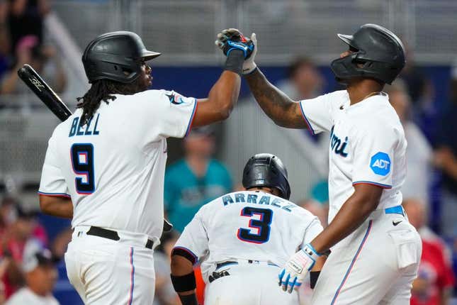 Sep 17, 2023; Miami, Florida, USA; Miami Marlins designated hitter Jorge Soler, right, celebrates with first baseman Josh Bell (9) after hitting a home run against the Atlanta Braves during the sixth inning at loanDepot Park.