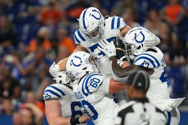 The Indianapolis Colts celebrate a touchdown during the second half of an NFL preseason game Saturday, Aug. 19, 2023, at Lucas Oil Stadium in Indianapolis. The Colts defeated the Bears, 24-17.
