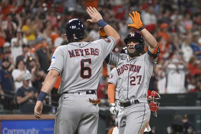 Jun 28, 2023; St. Louis, Missouri, USA; Houston Astros second baseman Jose Altuve (27) is congratulated by Houston Astros center fielder Jake Meyers (6) after Altuve hits a three-run home run against the St. Louis Cardinals in the eighth inning at Busch Stadium.
