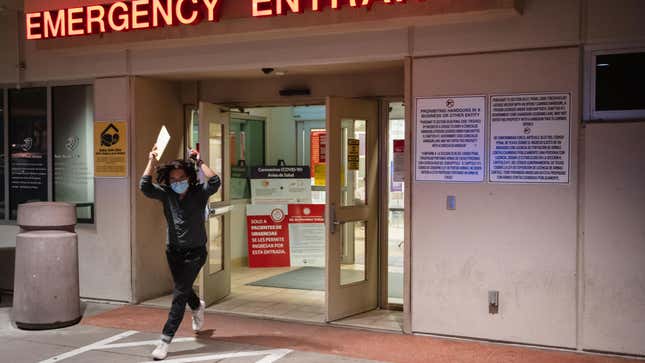 Man leaves the Las Palmas Medical Center in El Paso, Texas on November 3, 2020 to deliver an emergency ballot cast by a person hospitalized with covid-19.