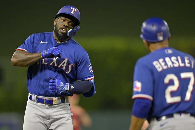 Texas Rangers' Jonah Heim runs the bases after a solo home run in