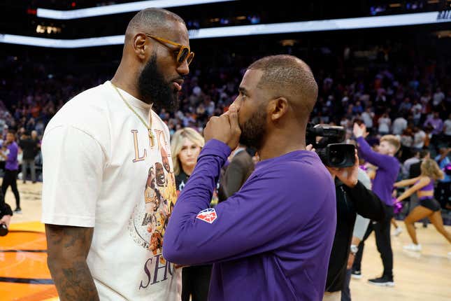 LeBron James #6 of the Los Angeles Lakers talks with Chris Paul #3 of the Phoenix Suns following the NBA game at Footprint Center on April 05, 2022 in Phoenix, Arizona. The Suns defeated the Lakers 121-110. (Photo by Christian Petersen/Getty Images)