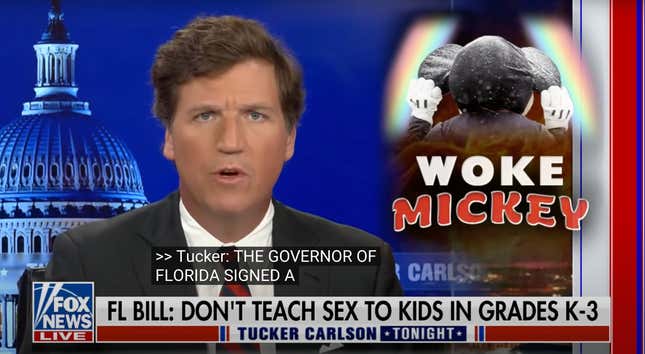 A screenshot of Tucker Carlson's show with an image that reads "Woke Mickey" in the background.