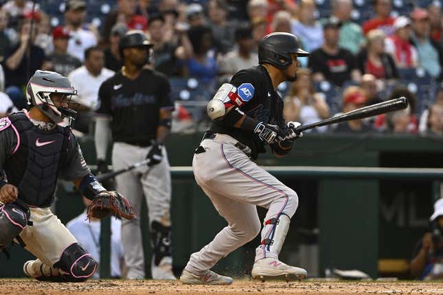 Jun 16, 2023; Washington, District of Columbia, USA; Miami Marlins second baseman Luis Arraez (3) hits a RBI single against the Washington Nationals during the fourth inning at Nationals Park.