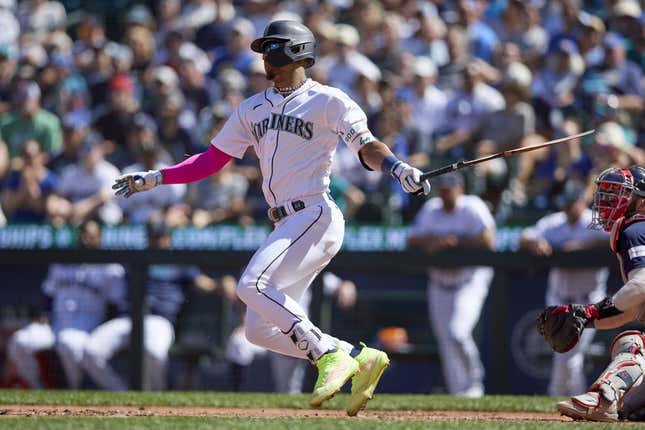 Julio Rodriguez breaks his bat hitting an RBI single against the Boston Red Sox during the seventh inning at T-Mobile Park.