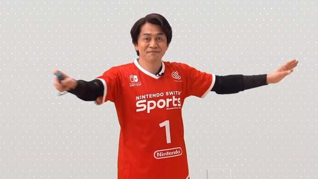 A Nintendo executive wearing a Nintendo Switch Sports jersey swings a joy-con.