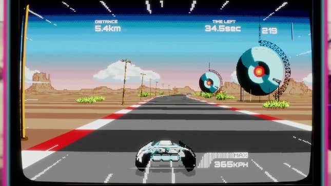 A vehicle races forward on a track in an arcade game.