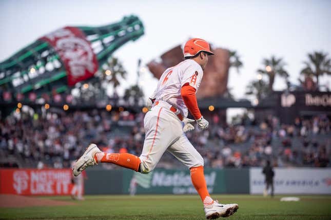 Mitch Haniger of the San Francisco Giants rounds the bases after