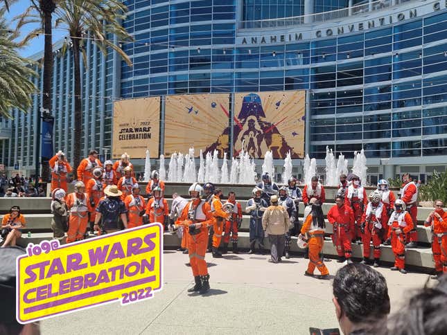 Cosplayers dressed as Rebel pilots in front of the convention center for Star Wars Celebration 2022. 