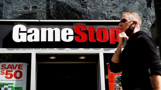 A customer walks outside a GameStop retail shop. 