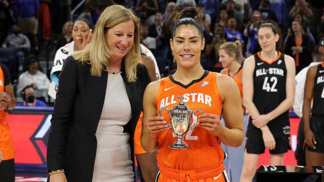 Kelsey Plum #10 of Team Wilson is presented with the MVP trophy during the 2022 AT&amp;T WNBA All-Star Game at the Wintrust Arena on July 10, 2022, in Chicago, Illinois.