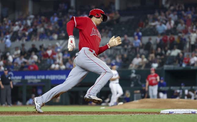 Jun 13, 2023; Arlington, Texas, USA;  Los Angeles Angels designated hitter Shohei Ohtani (17) rounds third base and scores during the ninth inning against the Texas Rangers at Globe Life Field.