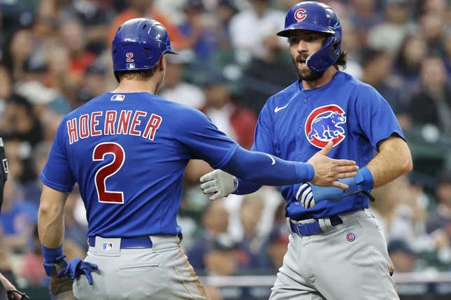 Aug 23, 2023; Detroit, Michigan, USA;  Chicago Cubs second baseman Nico Hoerner (2) and shortstop Dansby Swanson (7) congratulate each other after scoring in the third inning against the Detroit Tigers at Comerica Park.