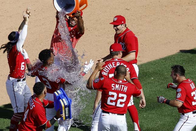 Aug 13, 2023; Washington, District of Columbia, USA; Washington Nationals second baseman Jeter Downs (3) celebrates with teammates after hitting a two run walk off single against the Oakland Athletics during the ninth inning at Nationals Park.