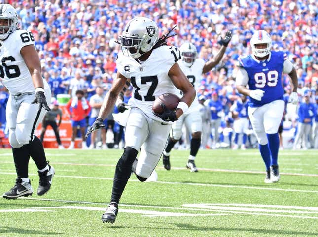 Sep 17, 2023; Orchard Park, New York, USA; Las Vegas Raiders wide receiver Davante Adams (17) runs for the end zone to score a touchdown in the first quarter against the Buffalo Bills at Highmark Stadium.