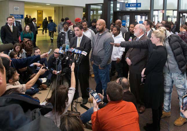 Leonard Gipson, center right, one of 15 convicted men, accompanied by Joshua Tepfer, center left, of the University of Chicago’s Exoneration Project, talks to reporters in Chicago, after a judge threw out the convictions of the men who claimed former Police Sgt. Ronald Watts had manufactured evidence that sent them to prison.