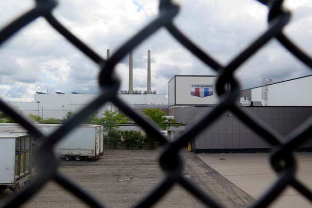 General Motor&#39;s Lansing Grand River Assembly plant is seen behind a fence , Tuesday, Sept. 12, 2023, in Lansing, Mich., where workers could soon be on the outside looking in with a potential strike set to begin on Thursday night. (AP Photo/Joey Cappelletti)