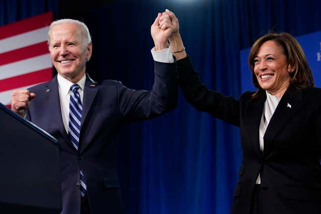 President Joe Biden and Vice President Kamala Harris stand on stage at the Democratic National Committee winter meeting, Feb. 3, 2023, in Philadelphia. 