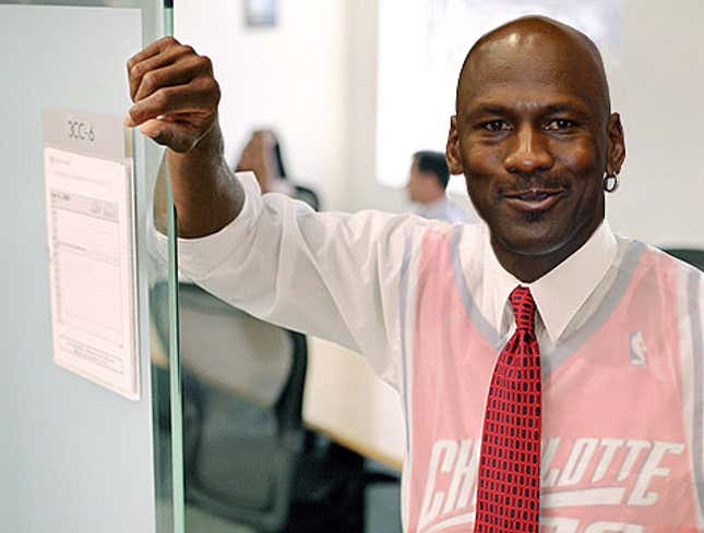 Image for article titled Michael Jordan Clearly Wearing Game-Ready Uniform Under Business Suit