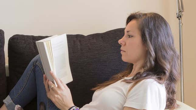Image for article titled Report: Girlfriend Probably Reading Some Book Called ‘The Midwife’s Promise’