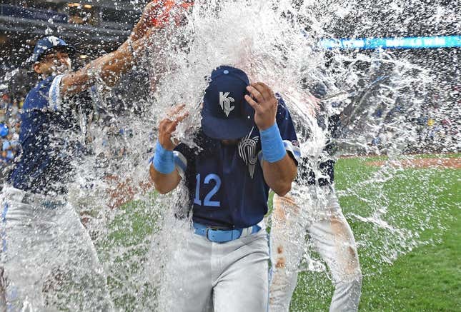 Sep 1, 2023; Kansas City, Missouri, USA;  Kansas City Royals designated hitter Nick Loftin (12) gets doused with water following a win over the Boston Red Sox at Kauffman Stadium.
